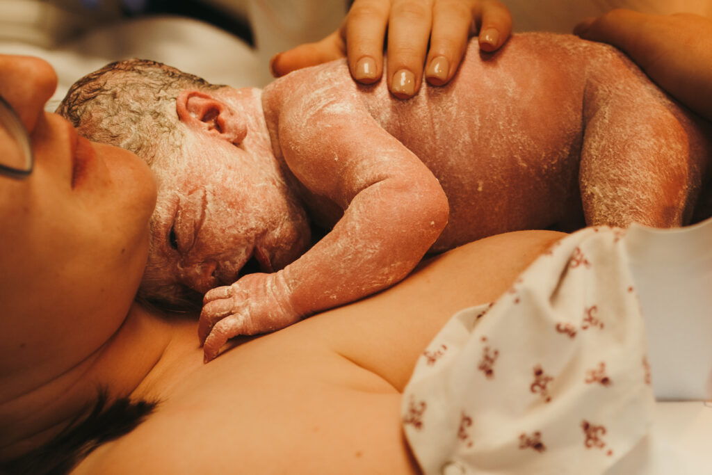 mothers first embrace newborn baby emotional moment