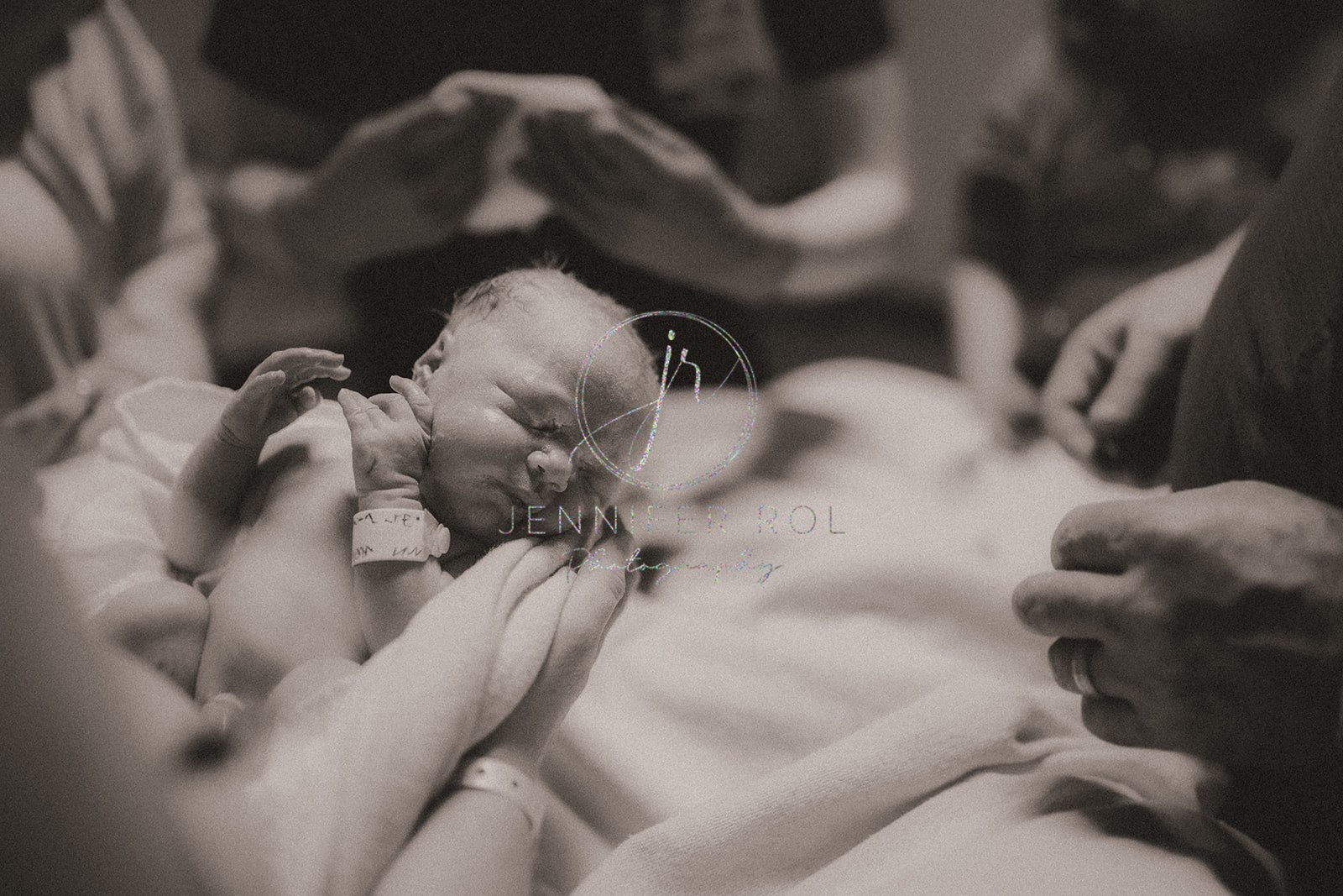 A newborn baby is held around the hospital bed thanks to help from 3D Ultrasound Missoula, MT