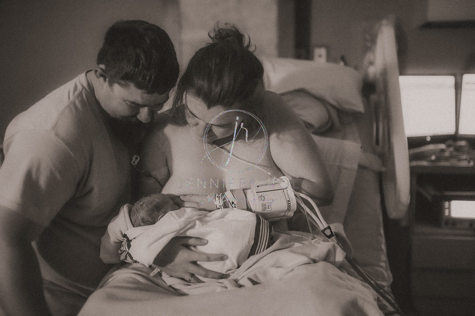 Excited new parents nurse their newborn in the hospital soon after birth after getting a 3D Ultrasound Missoula, MT