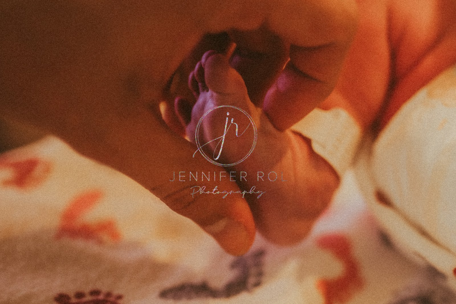 Details of a mom holding the foot of newborn in hospital after using Heart Strong Midwifery