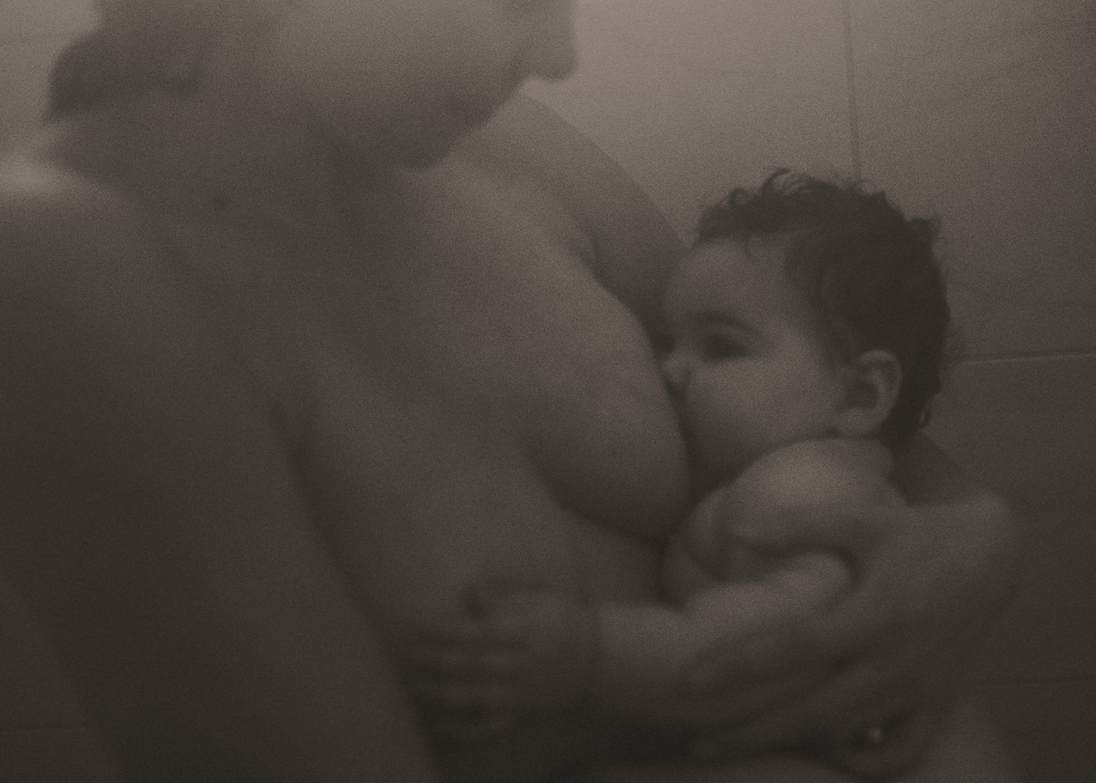 A new mom breastfeeds her infant in the shower after meeting with Nurse Family Partnership of Montana