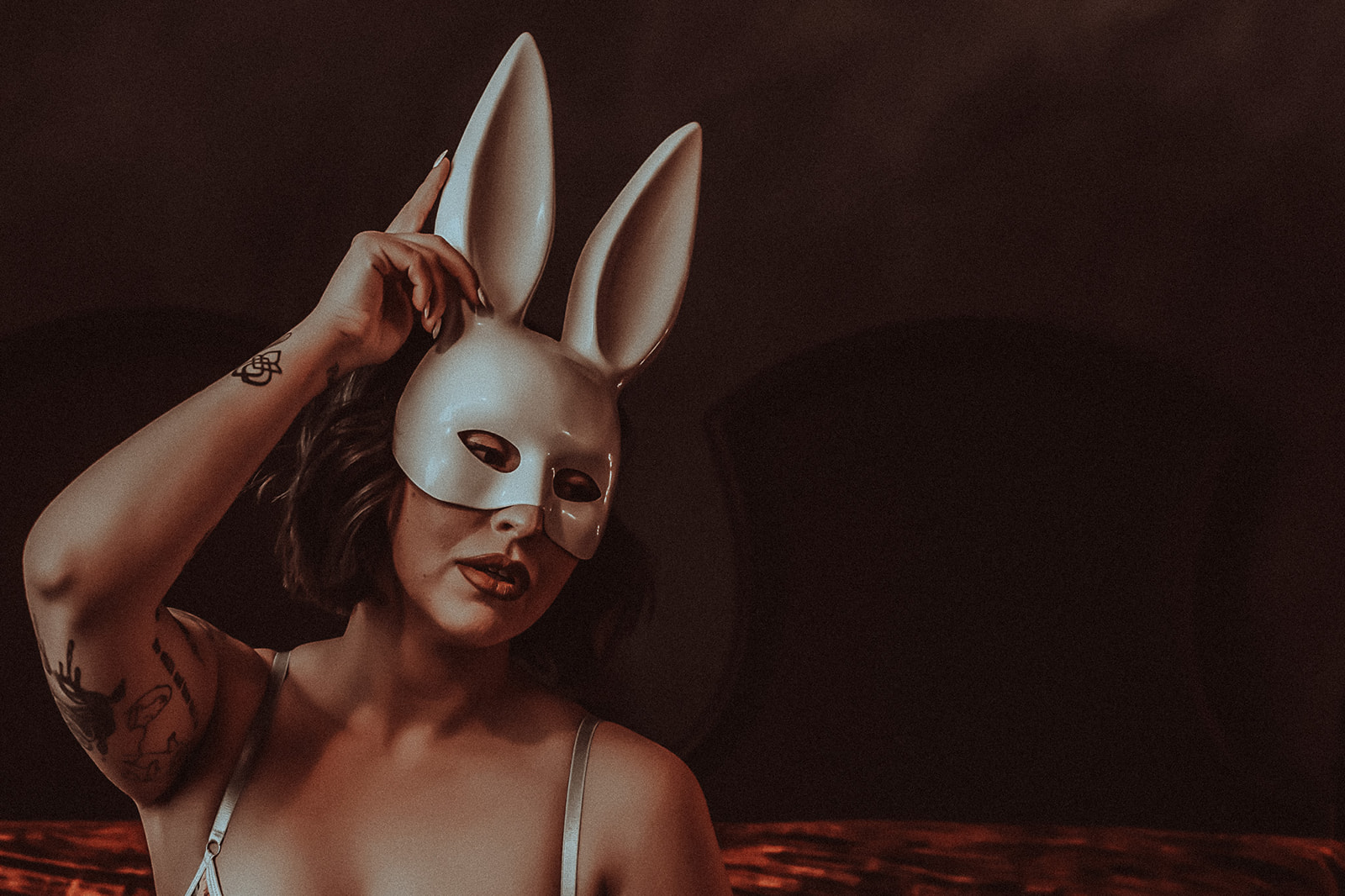 A woman in lingerie wearing a bunny mask while staying at Missoula boutique hotels