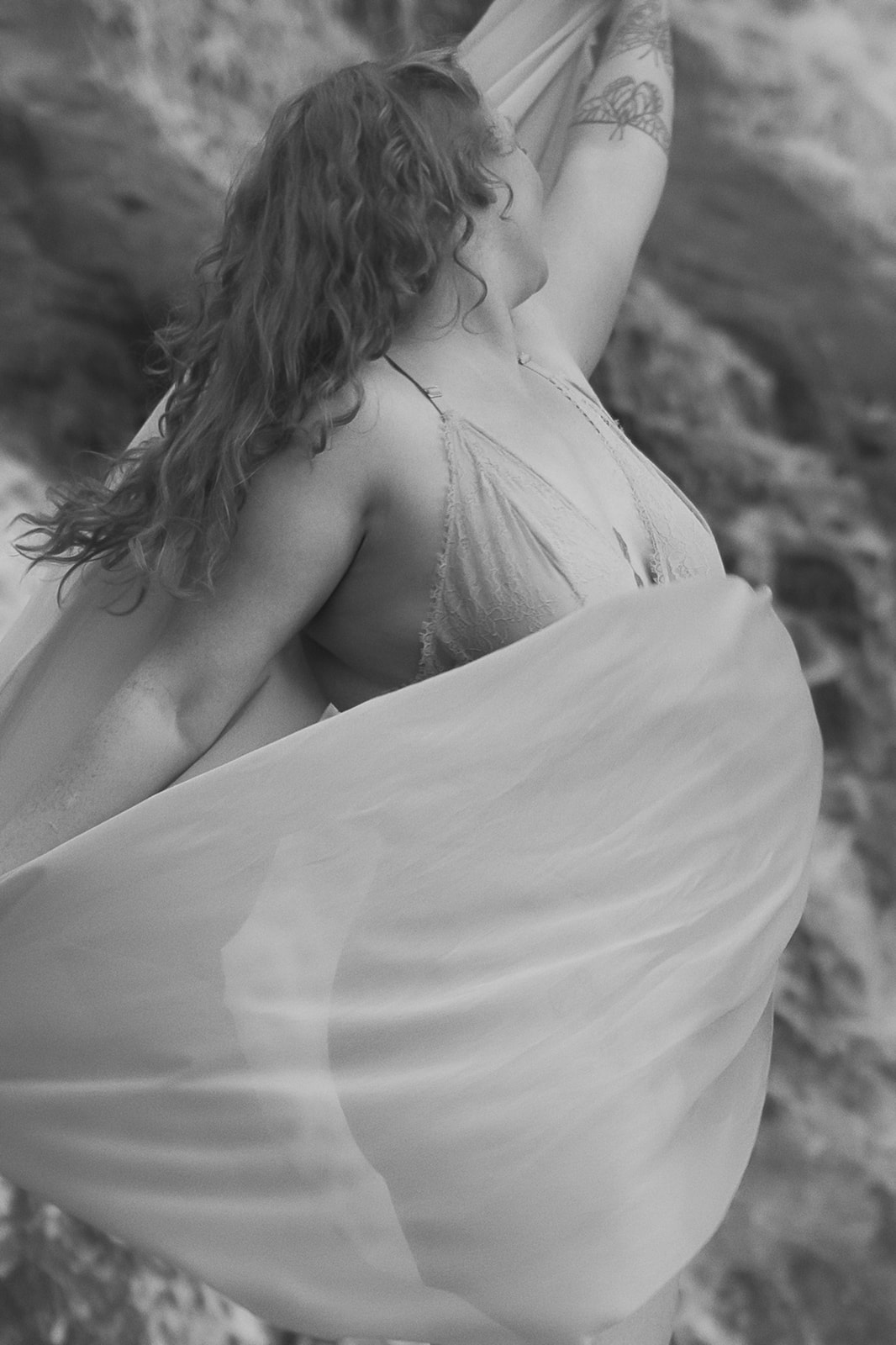 a woman dances in a sheer fabric after some excellent Montana Yoga